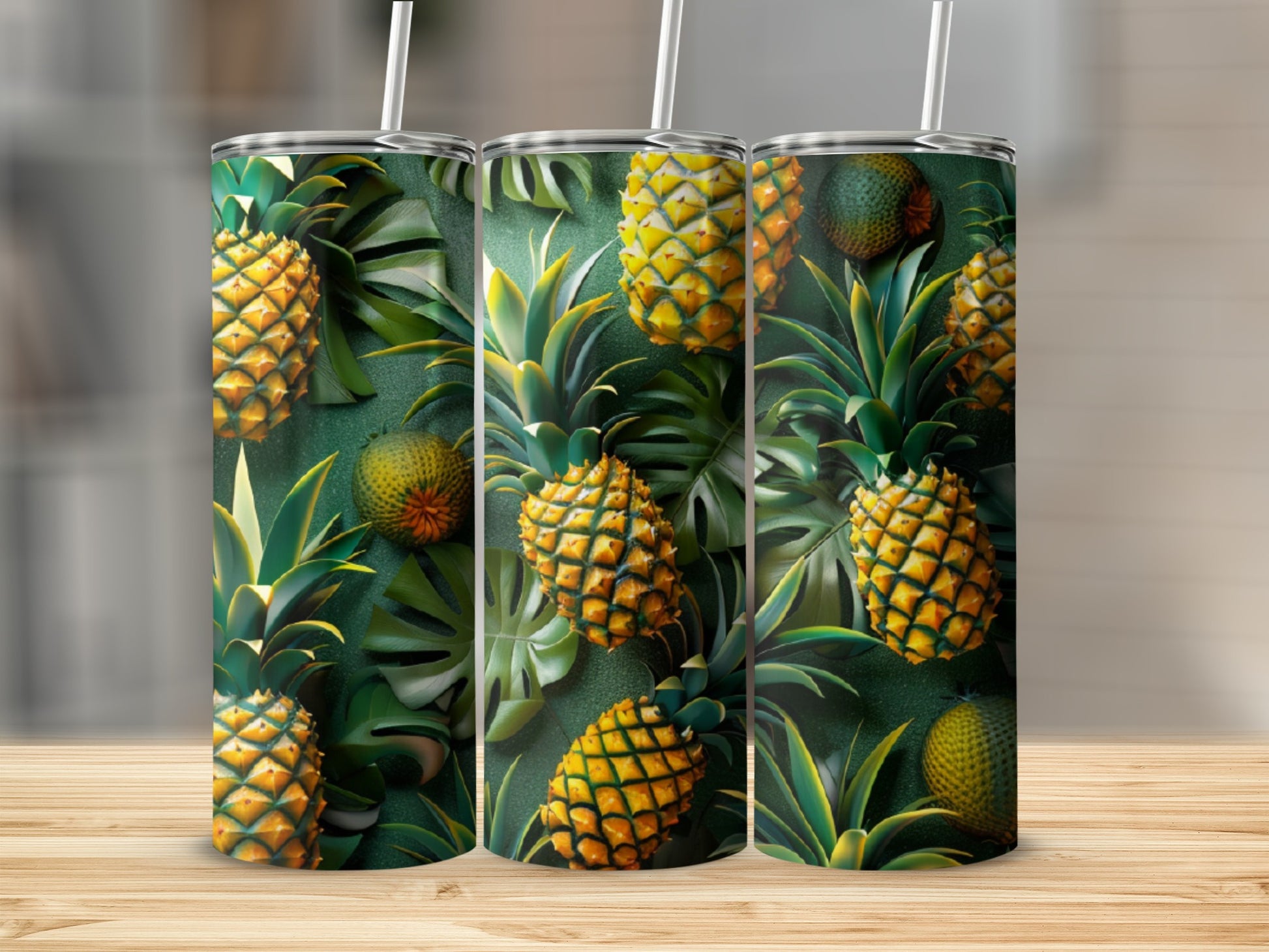 Three tumblers with a tropical pineapple and palm leaf pattern.