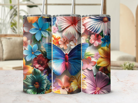 Three tumblers with colorful butterfly and floral designs.