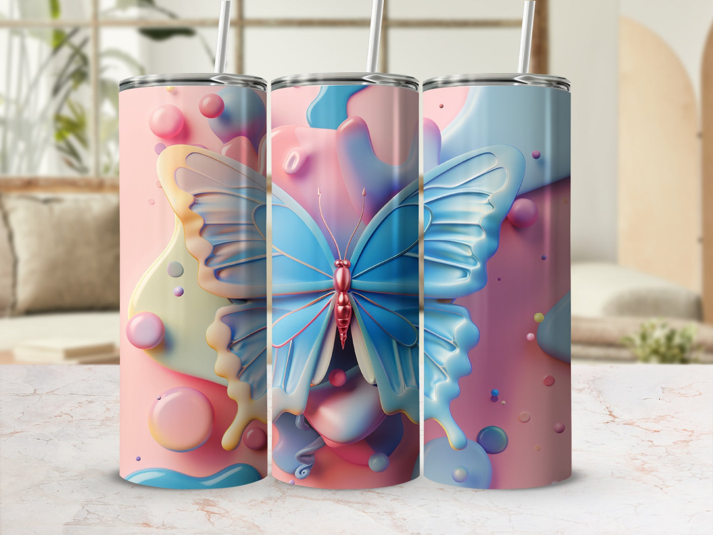 Three tumblers with a blue butterfly design on a light pink and blue background.