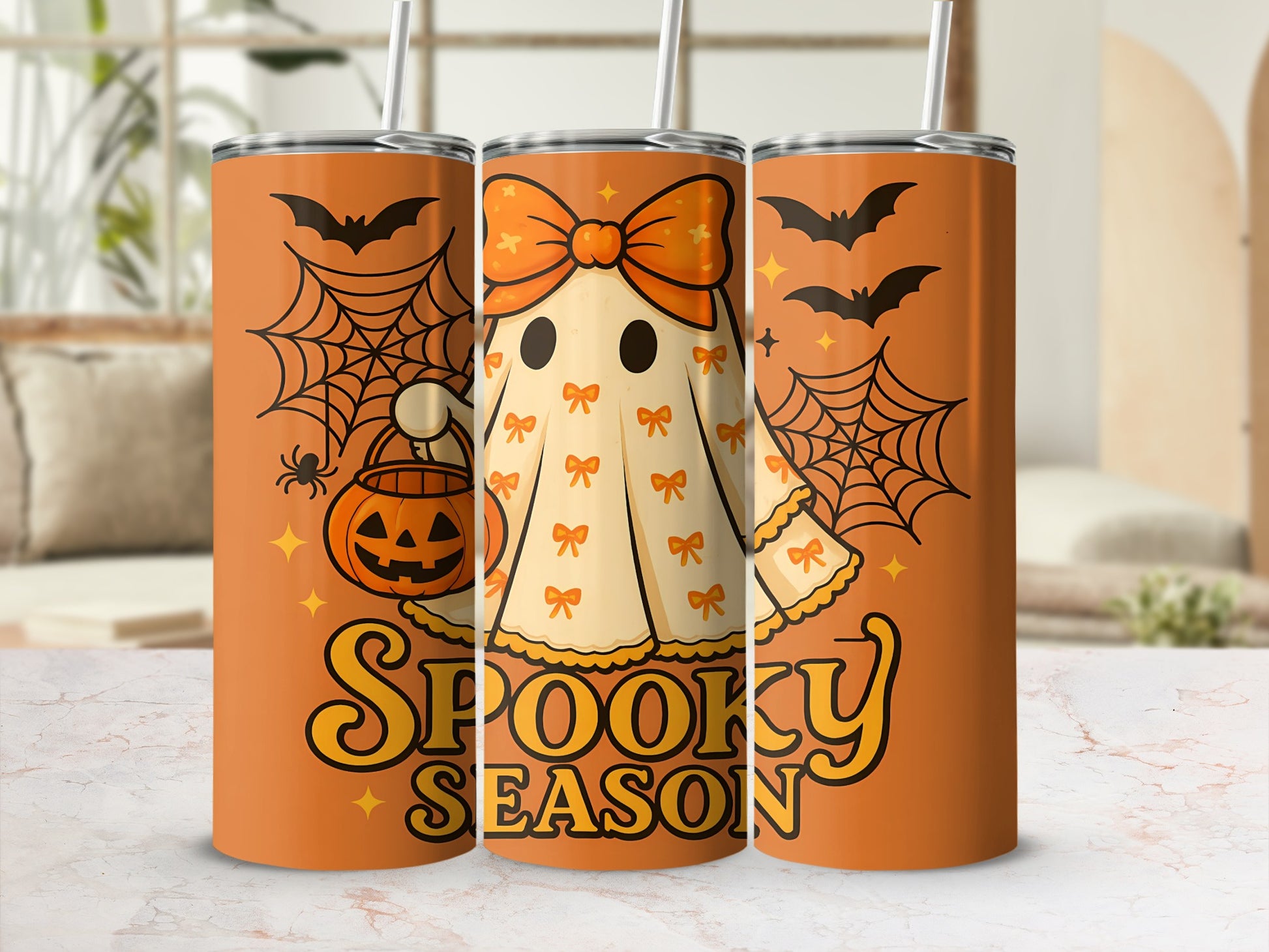 Orange tumblers with cute ghost, pumpkin, bats, and "Spooky Season" text.
