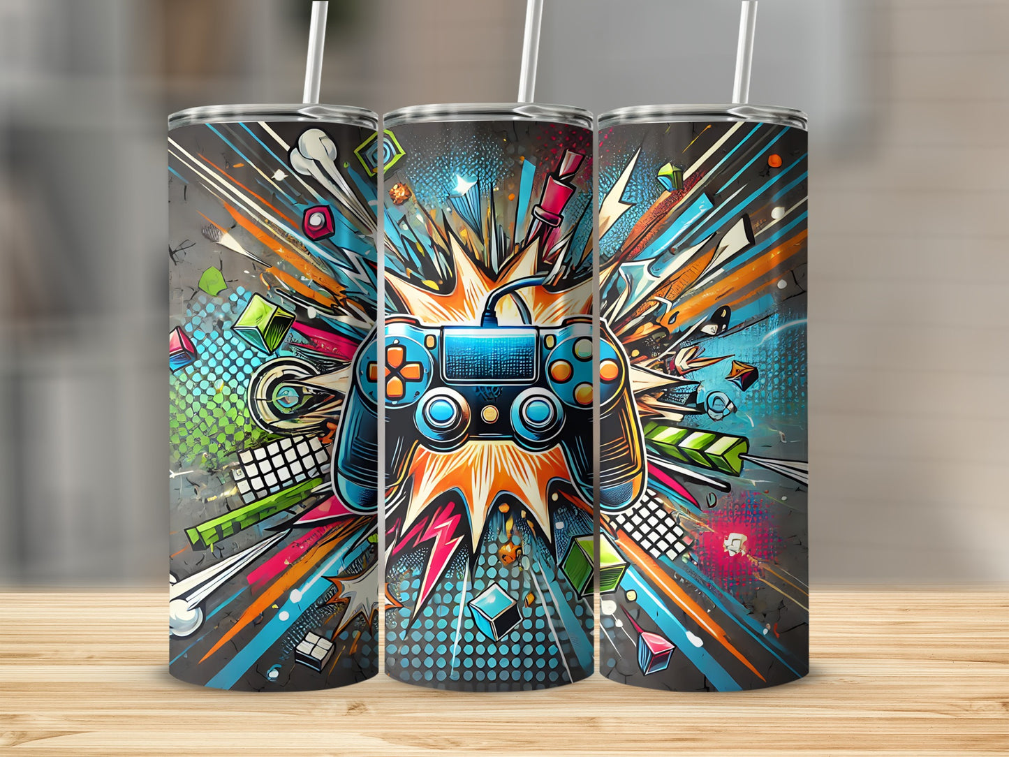 Three tumblers featuring a vibrant video game controller and abstract colorful bursts.