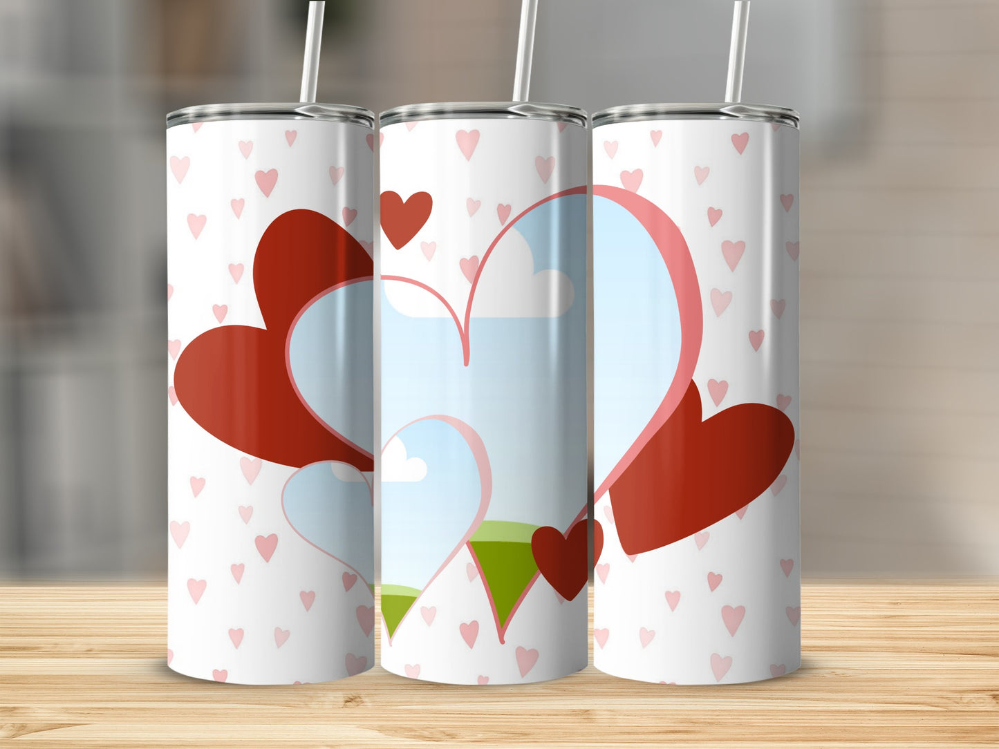Three tumblers with a white background and small pink hearts pattern.