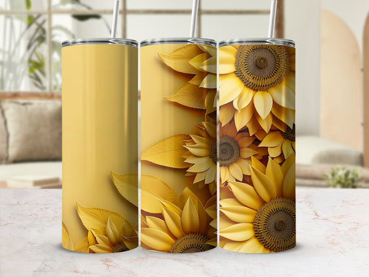Yellow tumblers with sunflowers and leaves on a light background.
