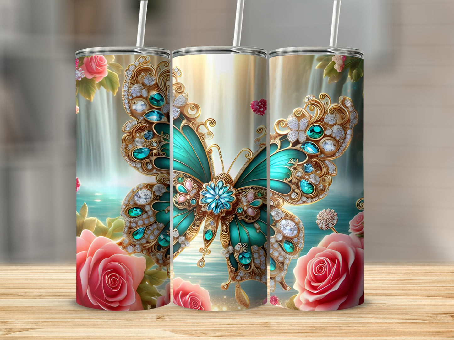 Three tumblers with jewel-encrusted butterfly and rose designs.