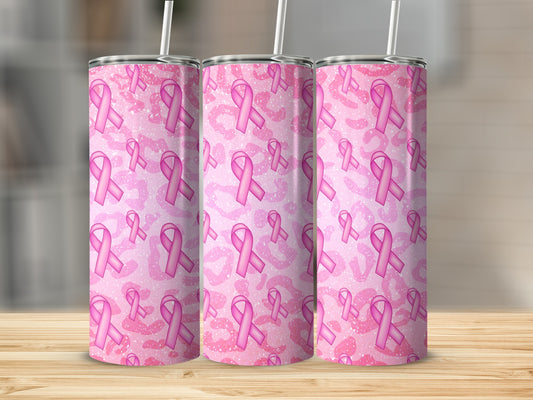 Three pink glittery breast cancer awareness ribbon tumblers on a wooden surface.