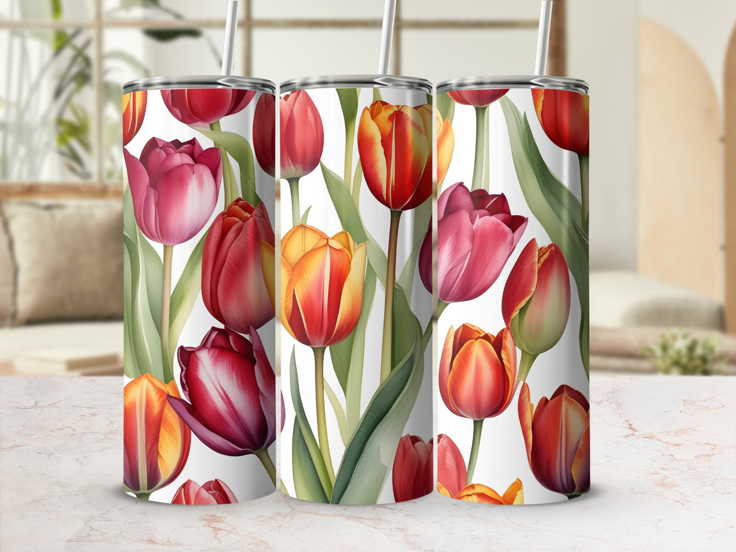 Tumblers with a watercolor floral design of red and orange tulips.