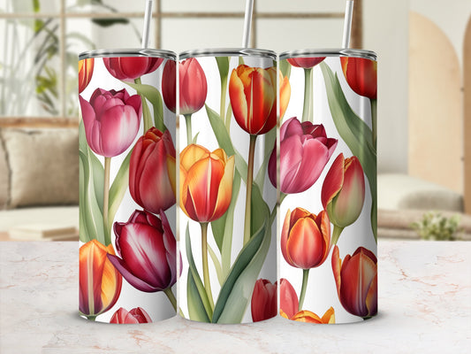 Tumblers with a watercolor floral design of red and orange tulips.