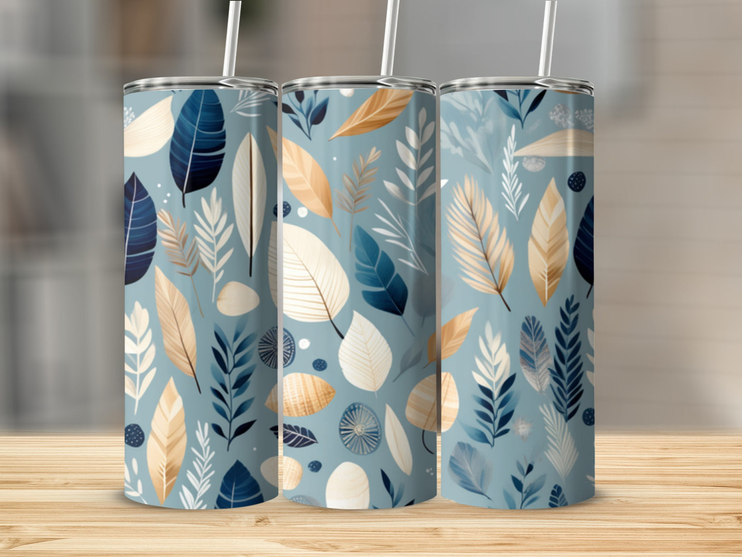 Three tumblers with a blue and beige abstract leaf and feather pattern.