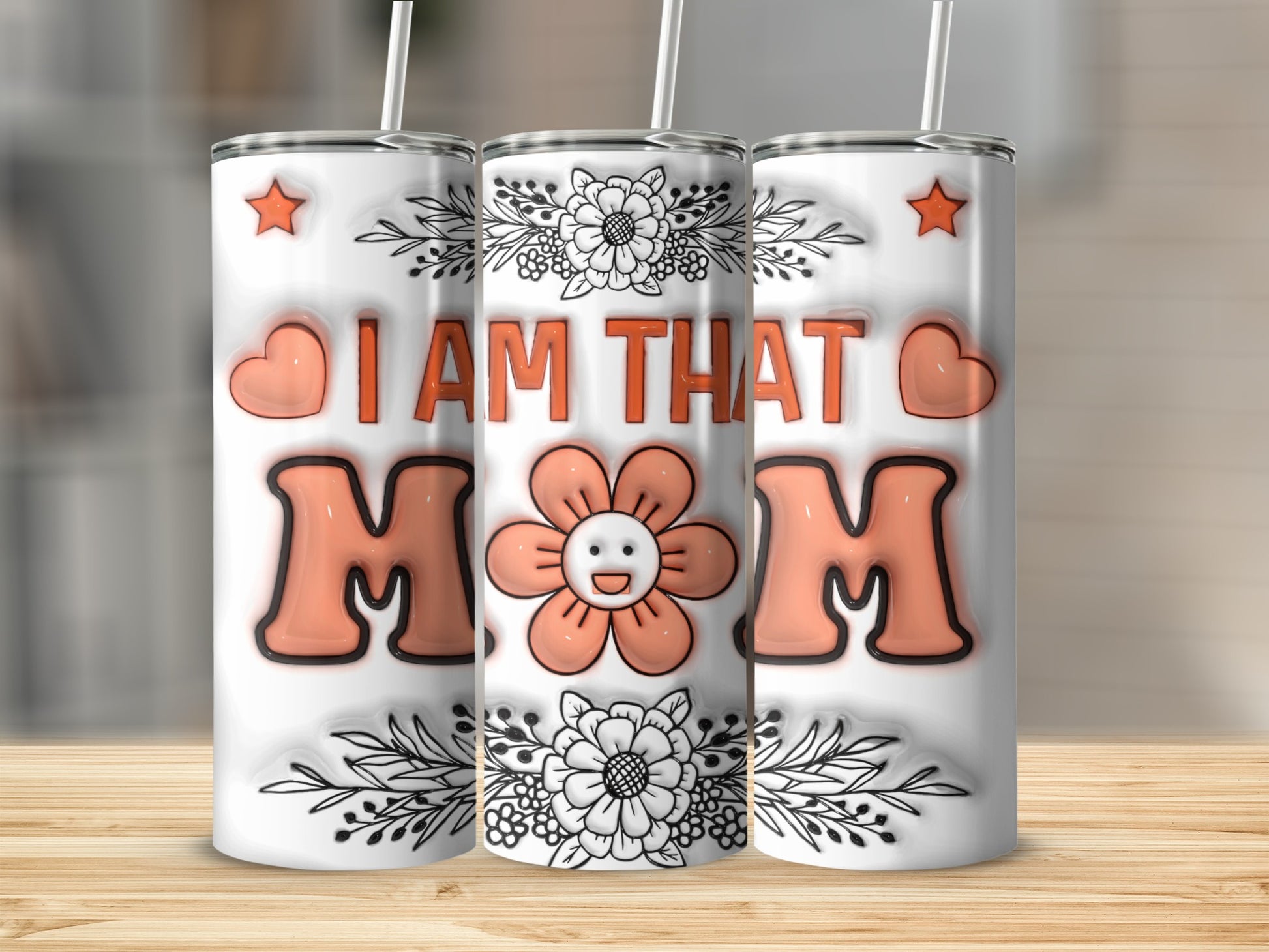 Tumbler with "I AM THAT MOM" text and floral design.