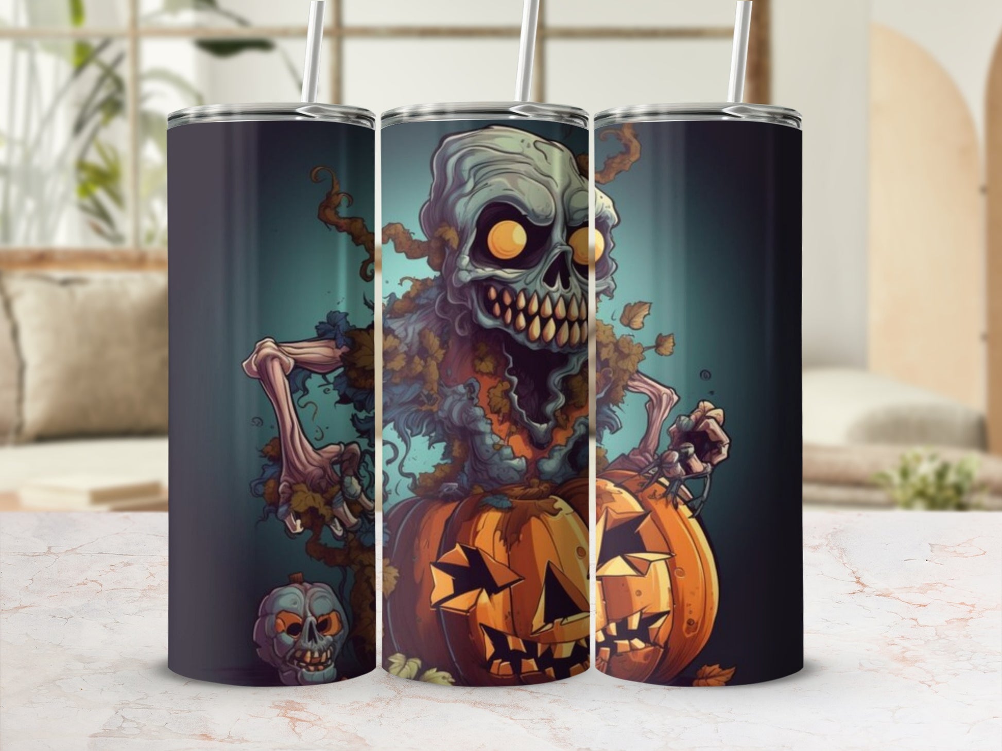 Three tumblers with a Halloween design featuring a skeleton and pumpkins.