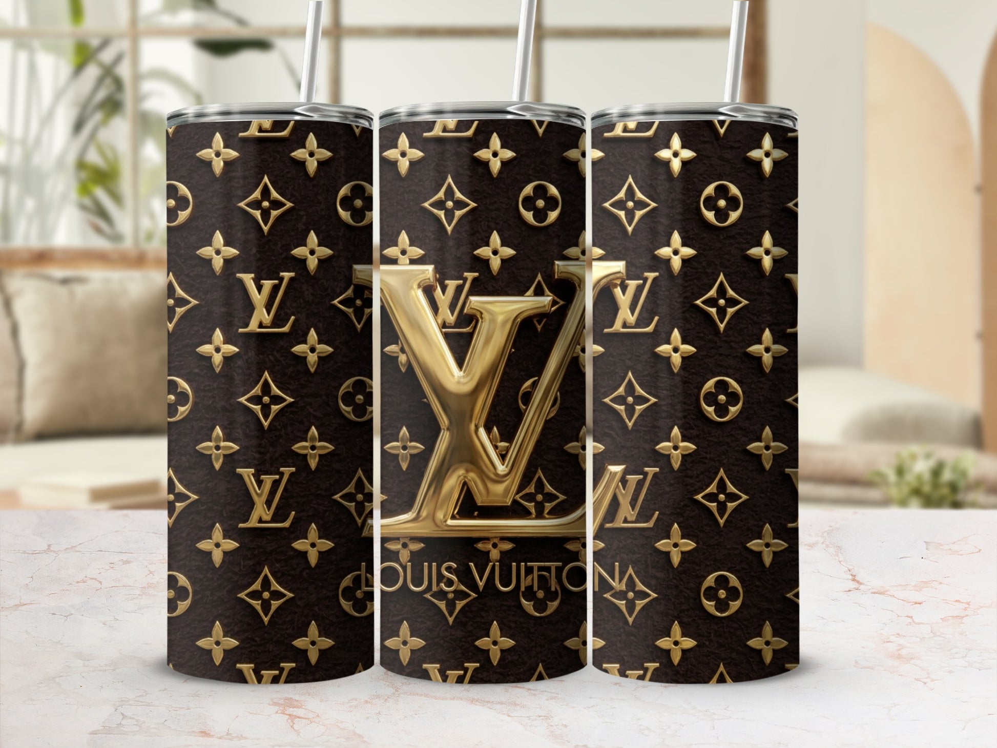 Three tumblers featuring the Louis Vuitton monogram pattern.