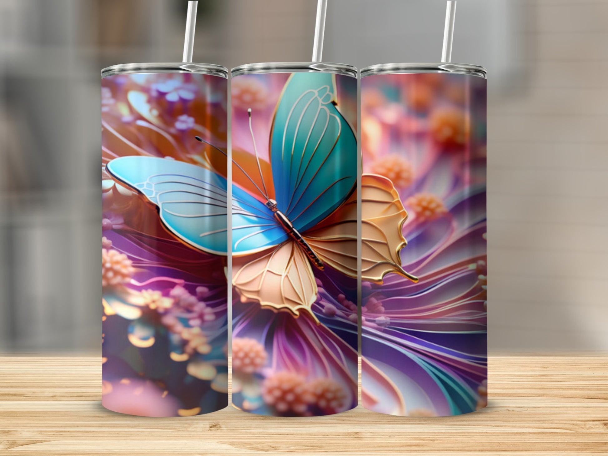 Three tumblers featuring a blue and gold butterfly and floral design.
