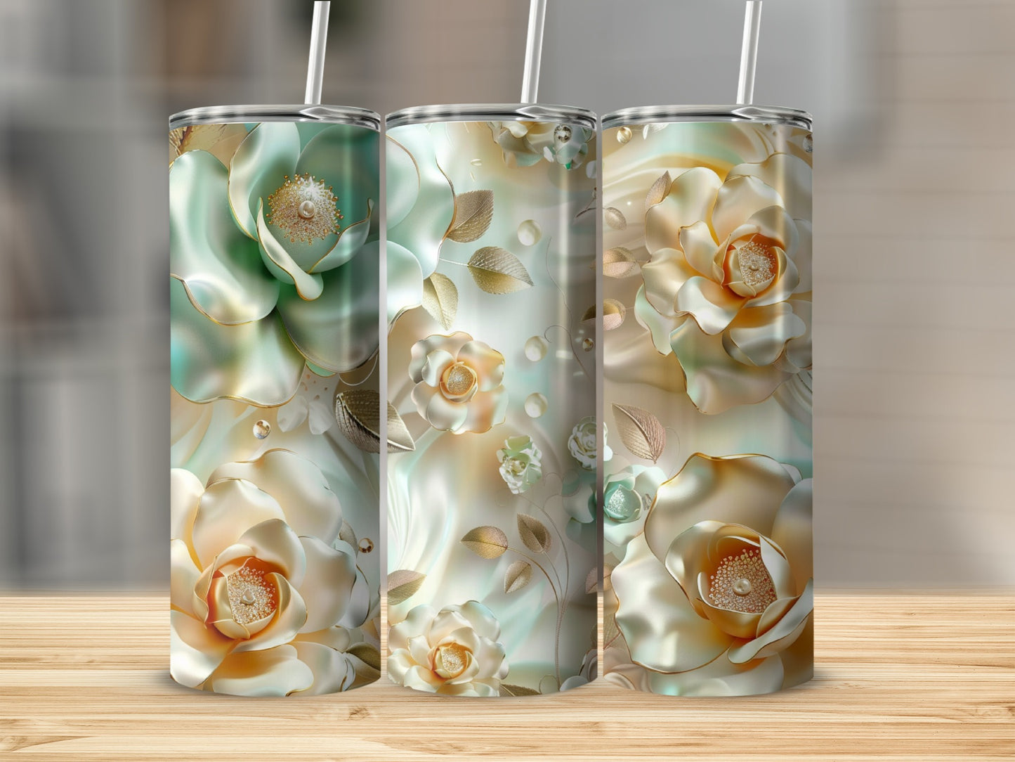 Three tumblers with iridescent floral designs and gold accents.