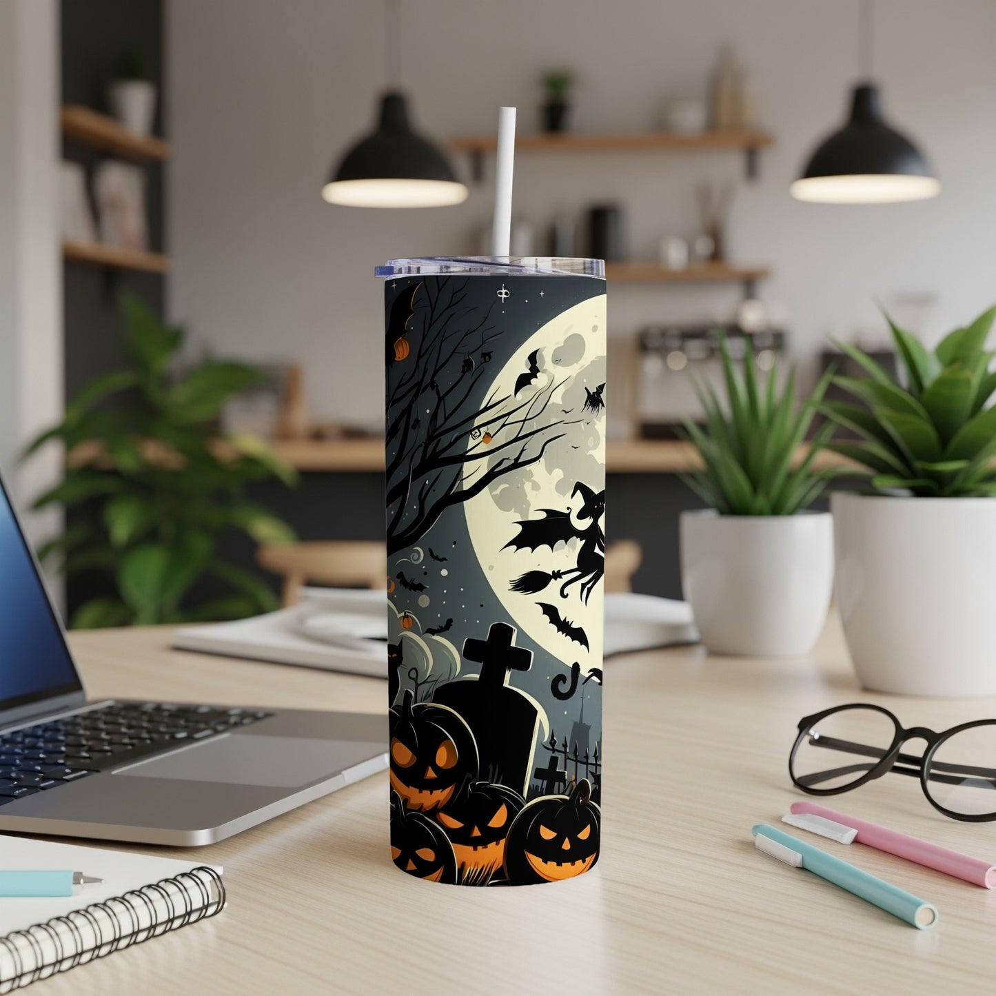Tumbler with Halloween witch, pumpkins, bats, and moon on a dark, spooky background.