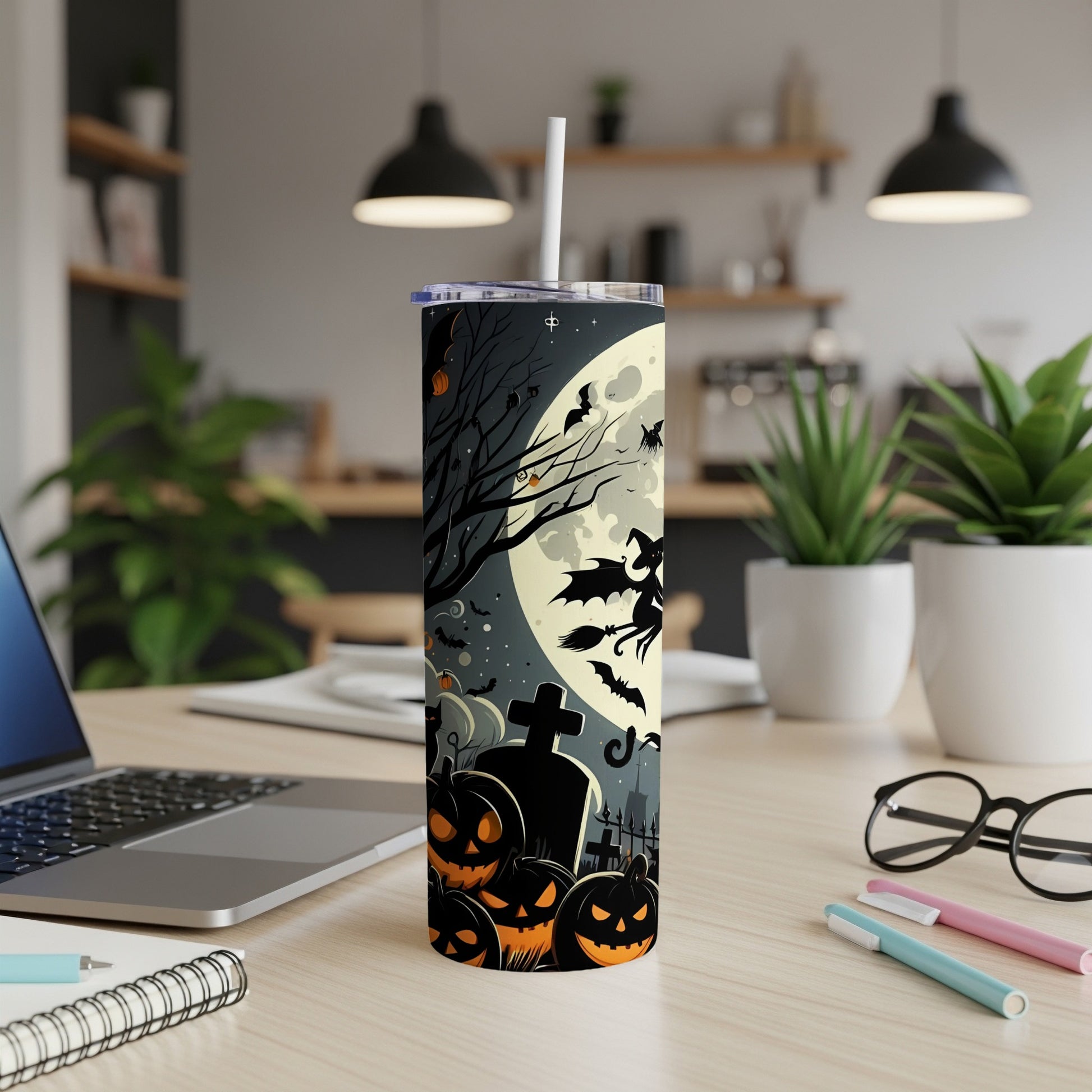 Tumbler with Halloween witch, pumpkins, bats, and moon on a dark, spooky background.