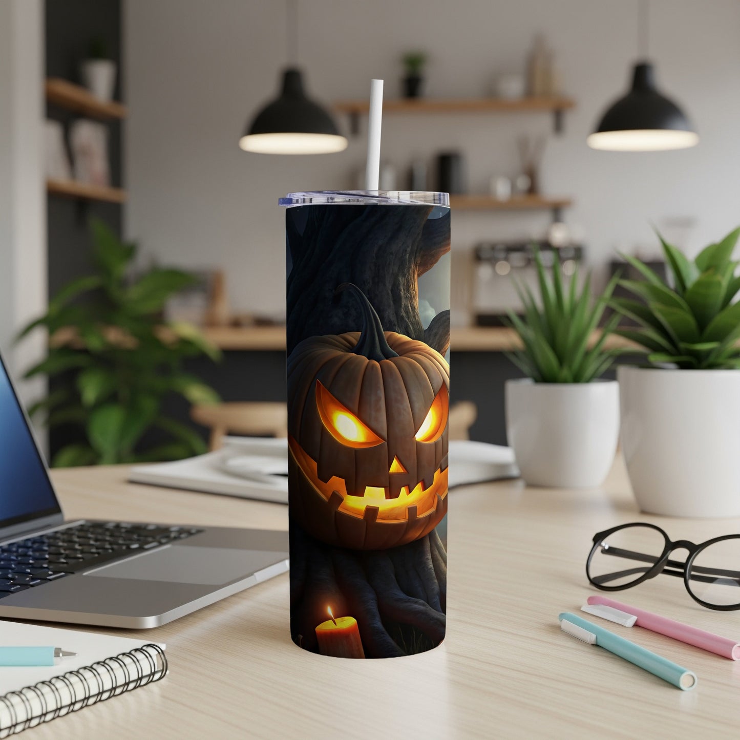 Tumbler with a carved, glowing jack-o'-lantern and candle design.