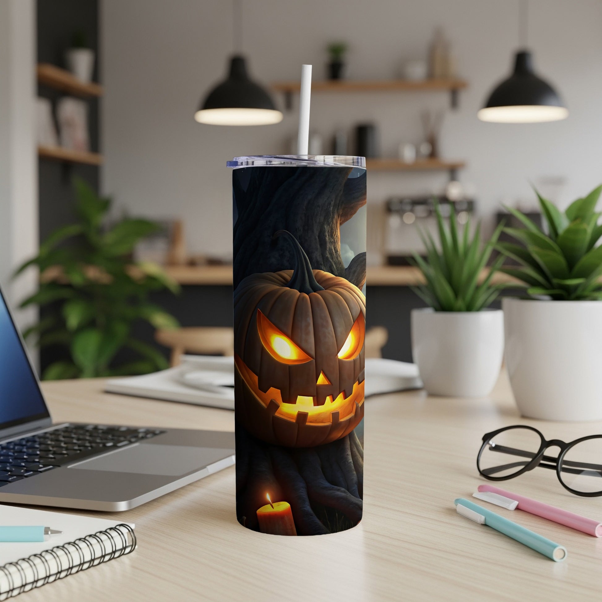 Tumbler with a carved, glowing jack-o'-lantern and candle design.