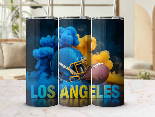 Blue and yellow smoke surrounds a football helmet and ball, with "LOS ANGELES" text.
