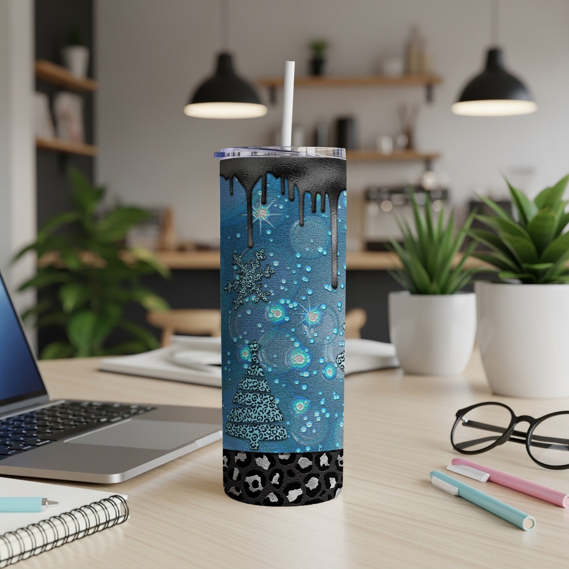 Blue glitter tumbler with Christmas tree and snowflake design.