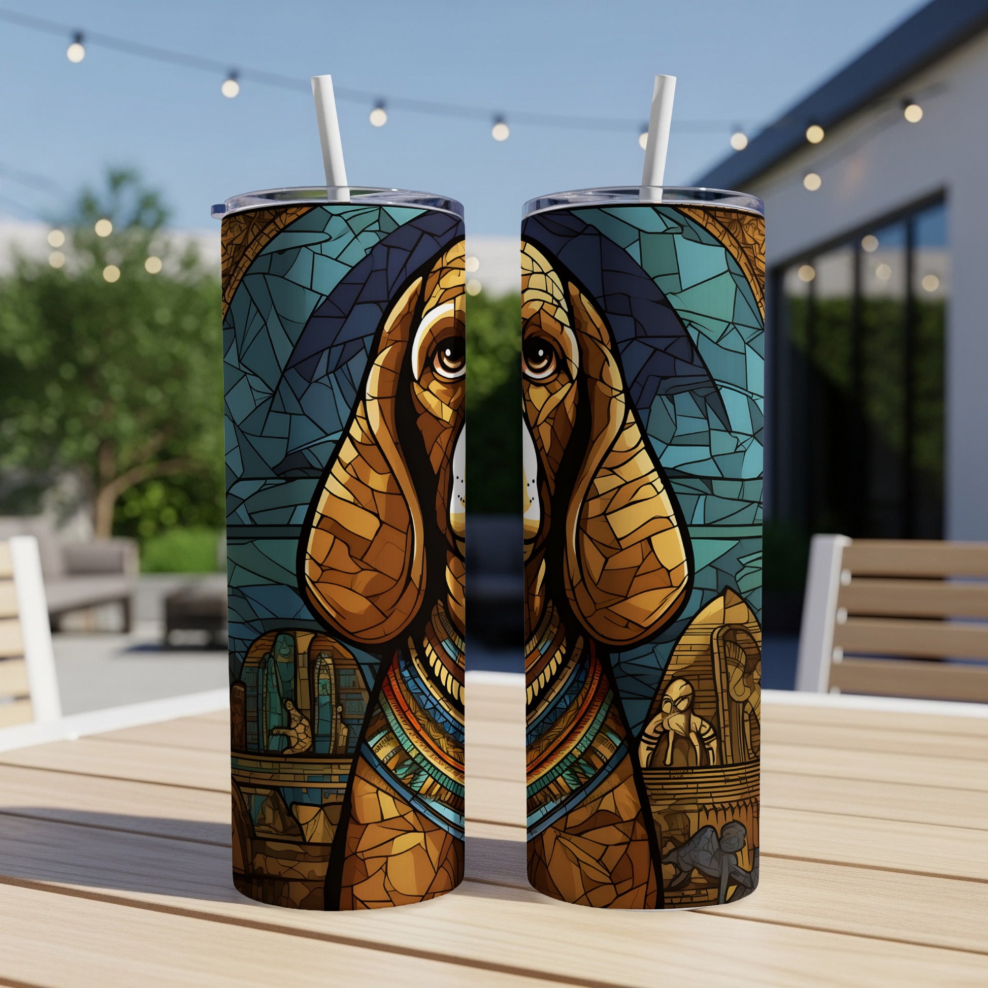 Two tumblers with stained-glass-style dog art, featuring Egyptian motifs.