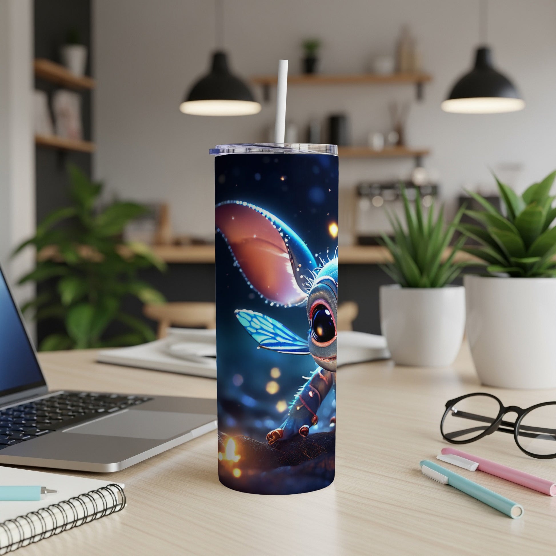 Cute alien creature with big eyes on a tumbler cup with a straw.