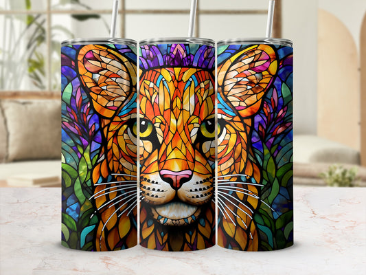 Stained glass lion face design on three tumblers with straw.