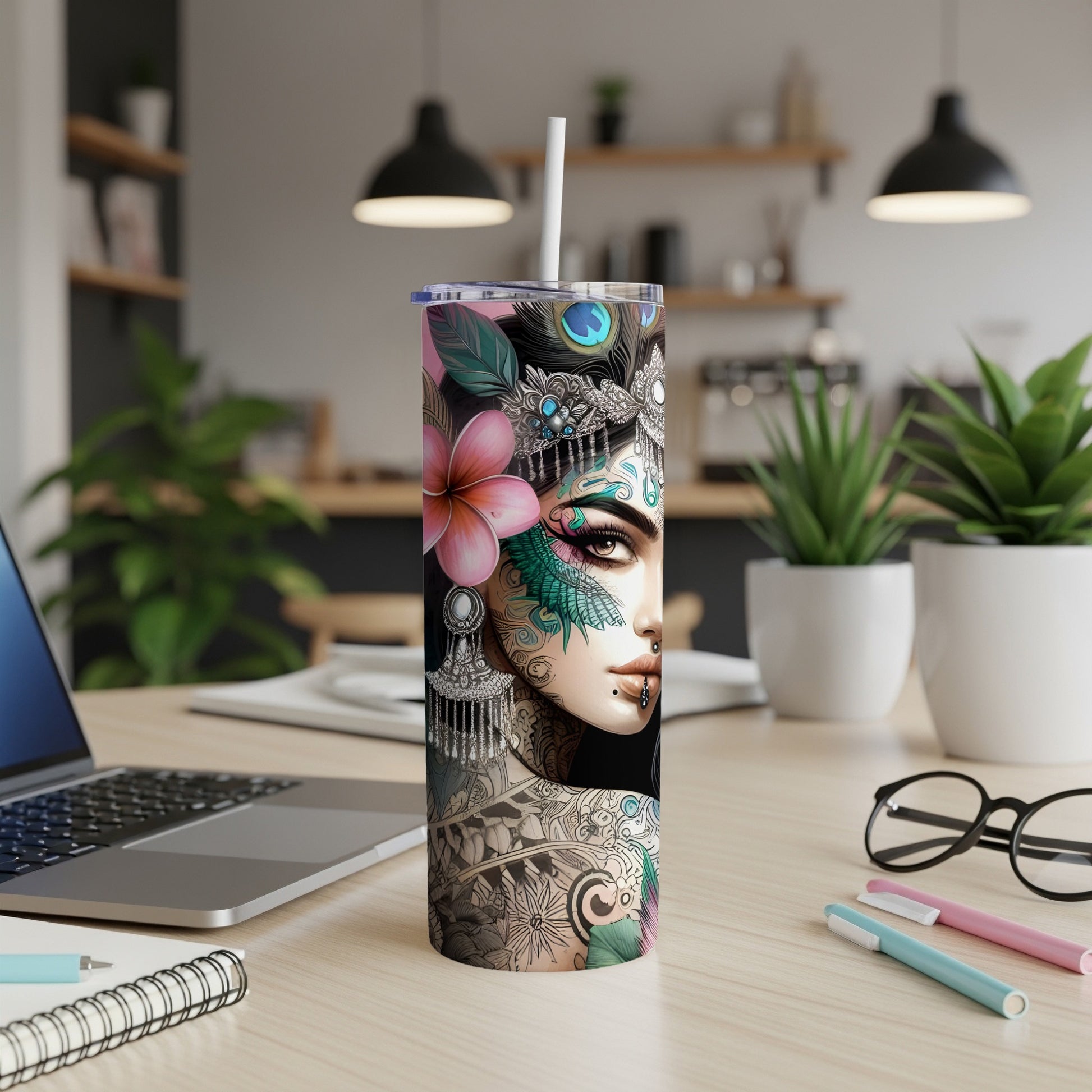 Woman with ornate tattoos and floral headdress on a stainless steel tumbler.