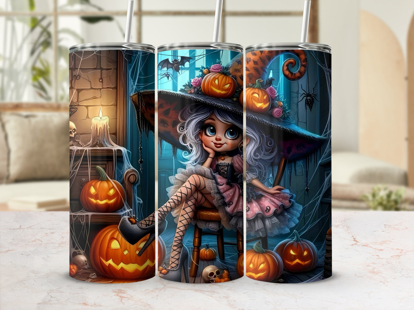 Three tumblers with a Halloween design featuring a witch, pumpkins, skulls, spiders, and a bat.