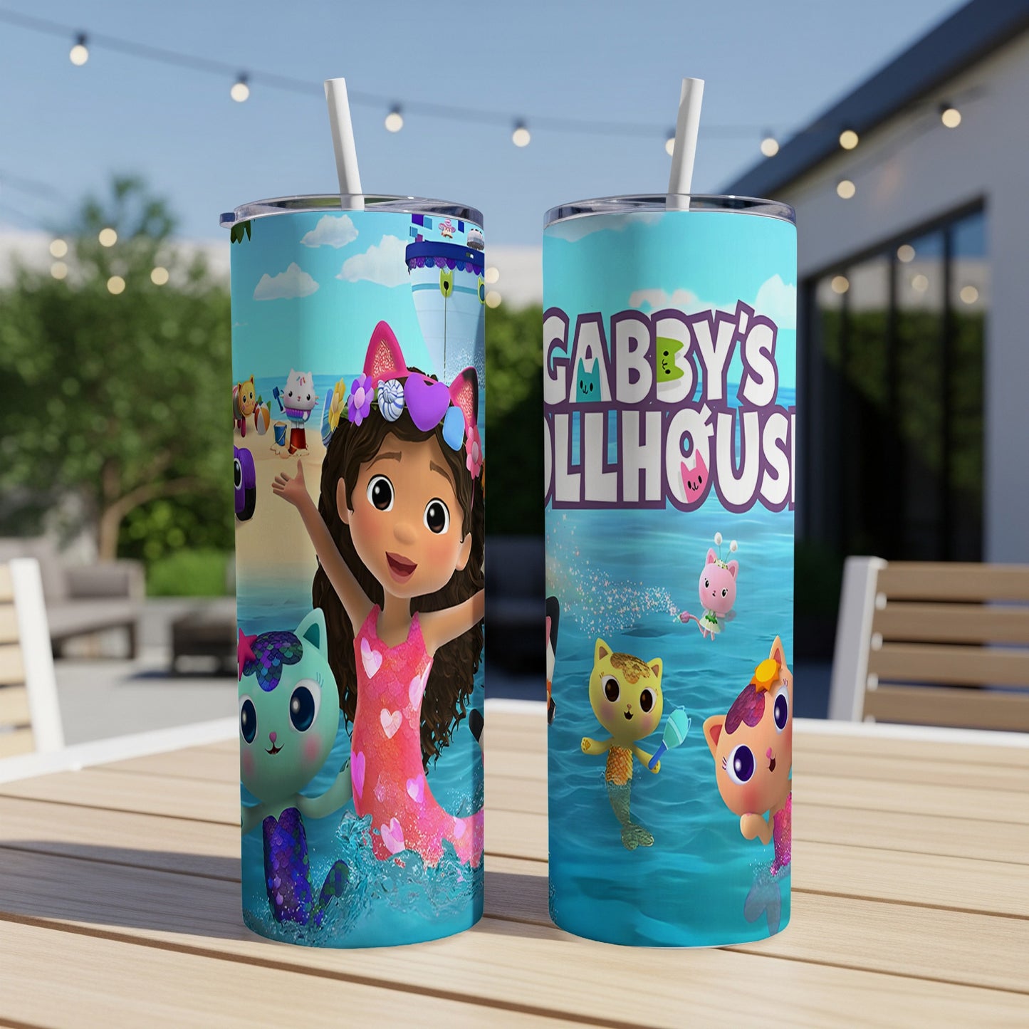 Gabby's Dollhouse characters on blue skinny tumblers with straws.