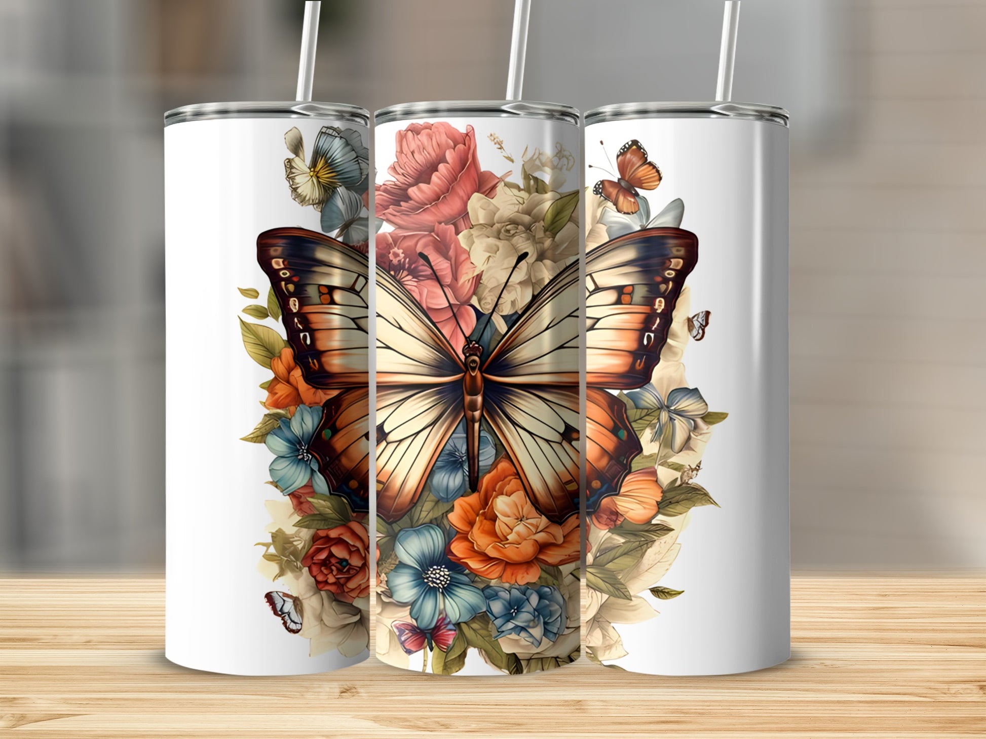 Three tumblers with a butterfly and floral design.