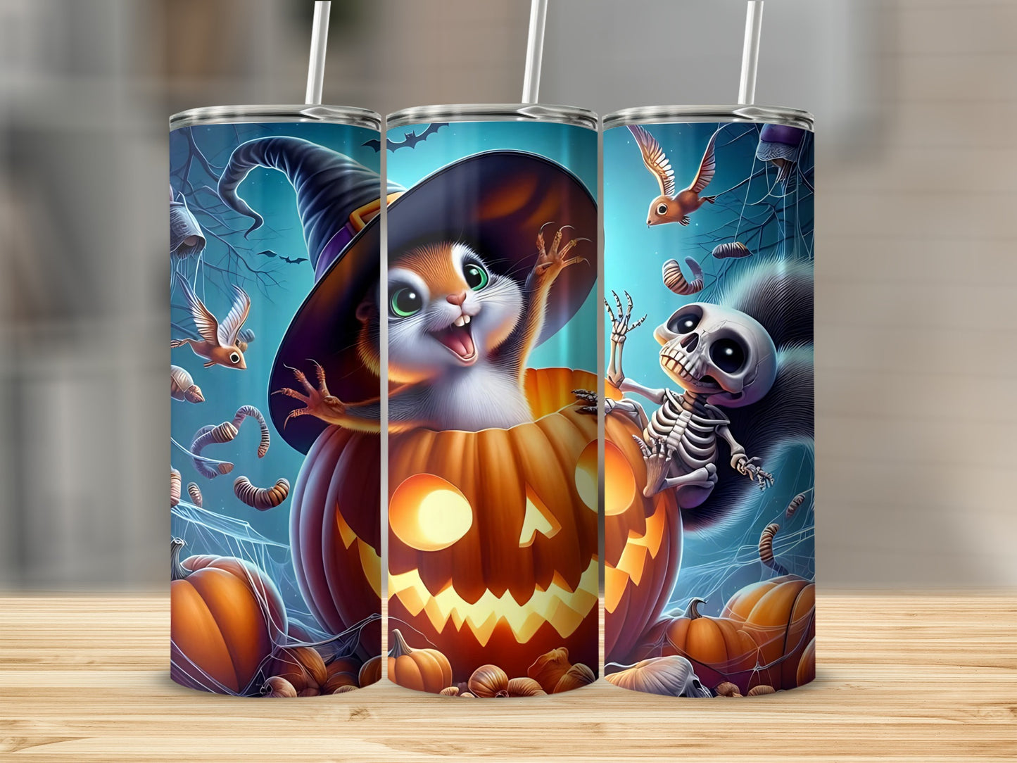 Halloween tumblers with spooky squirrel, skeleton, and pumpkin designs.