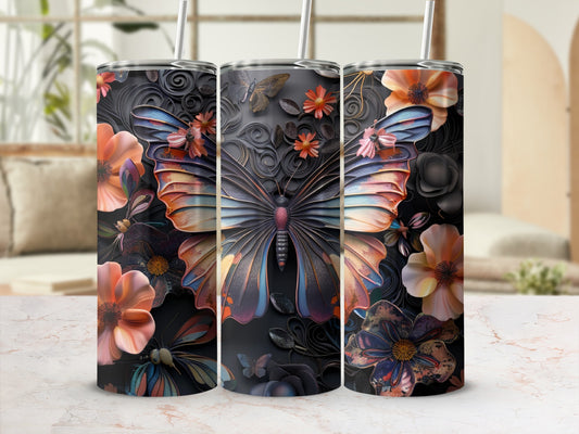 Three tumblers featuring a large butterfly and floral designs on a marble surface.