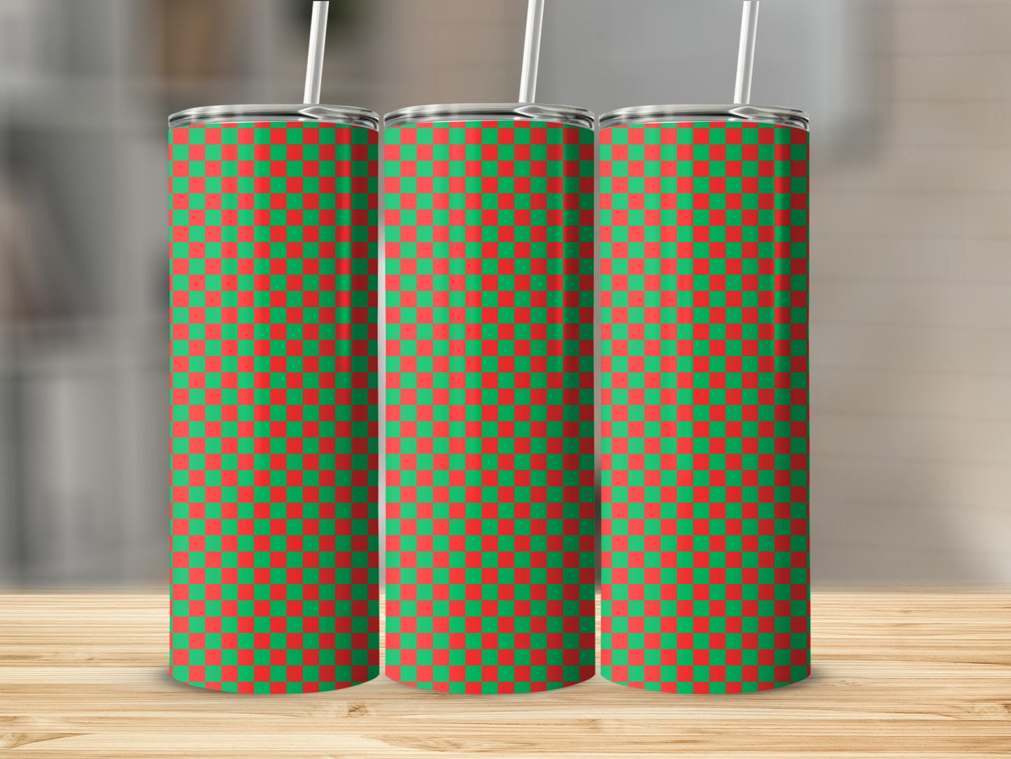 Three tall tumblers with red and green checkerboard pattern and white straws.