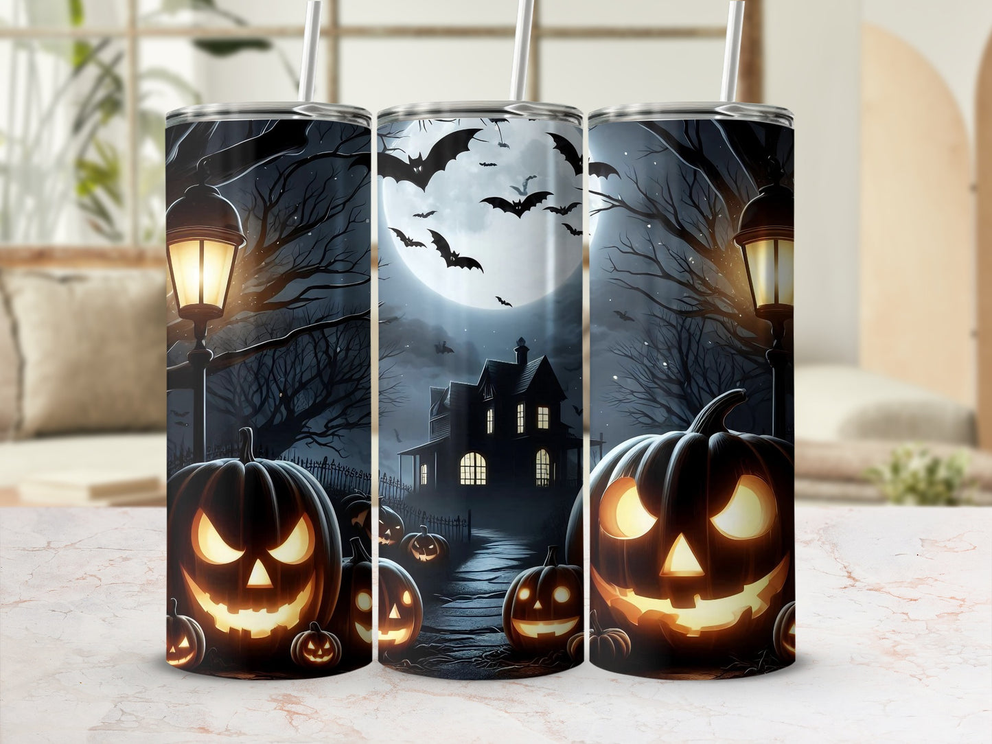 Halloween themed tumblers with jack-o'-lanterns, haunted house, and bats.