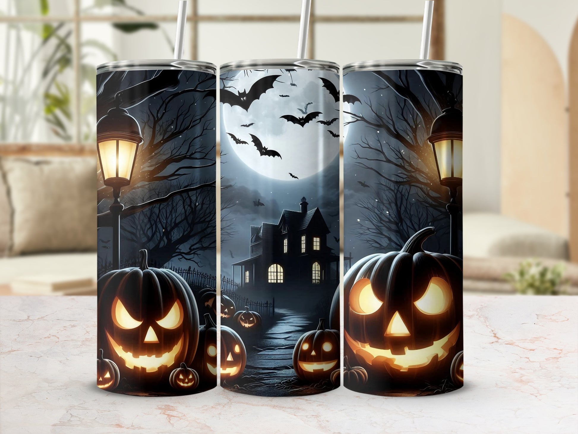 Halloween themed tumblers with jack-o'-lanterns, haunted house, and bats.