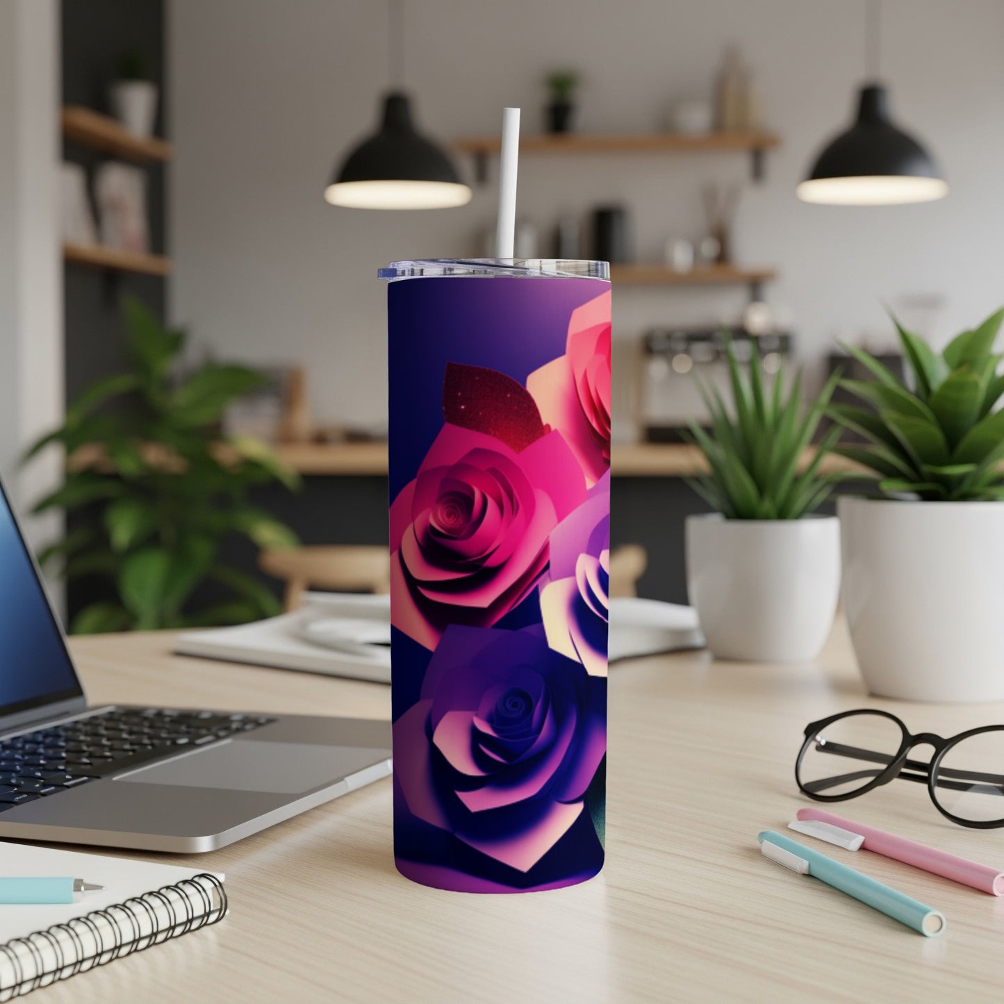 Pink and purple roses adorn a dark gradient tumbler with a straw.
