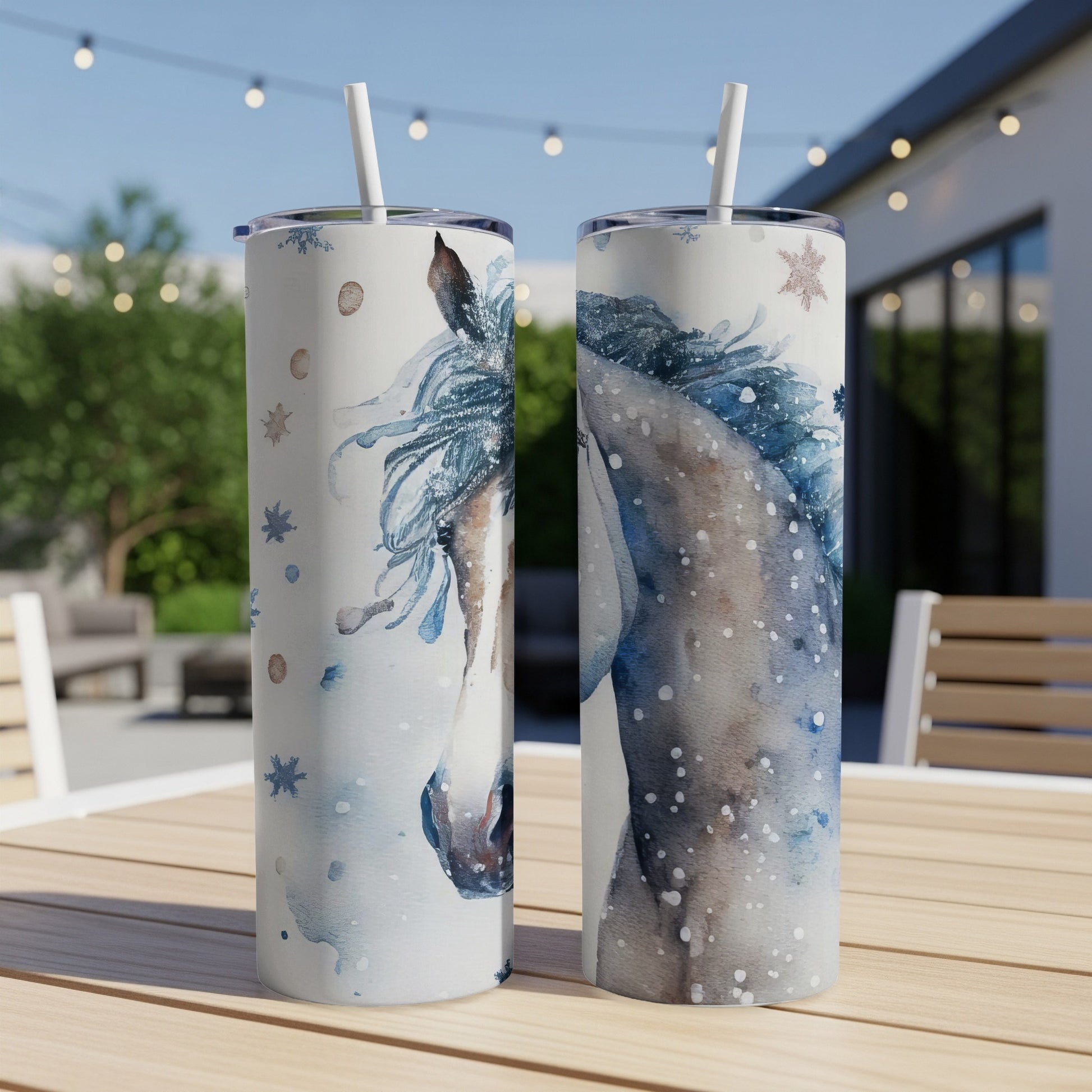 Two tumblers with watercolor horse and snowflake designs.