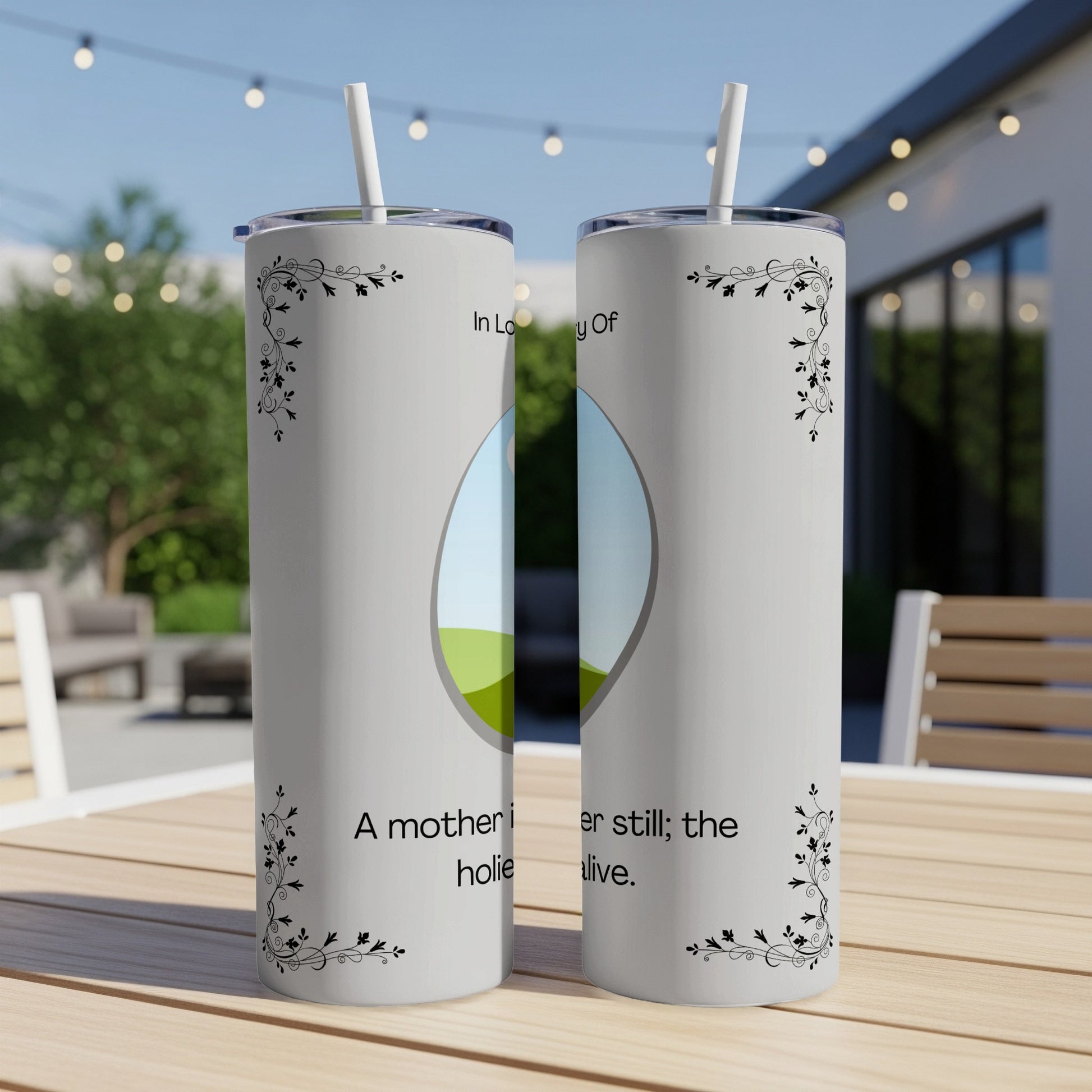 Two tumblers with floral accents and text about mothers, against an outdoor background.