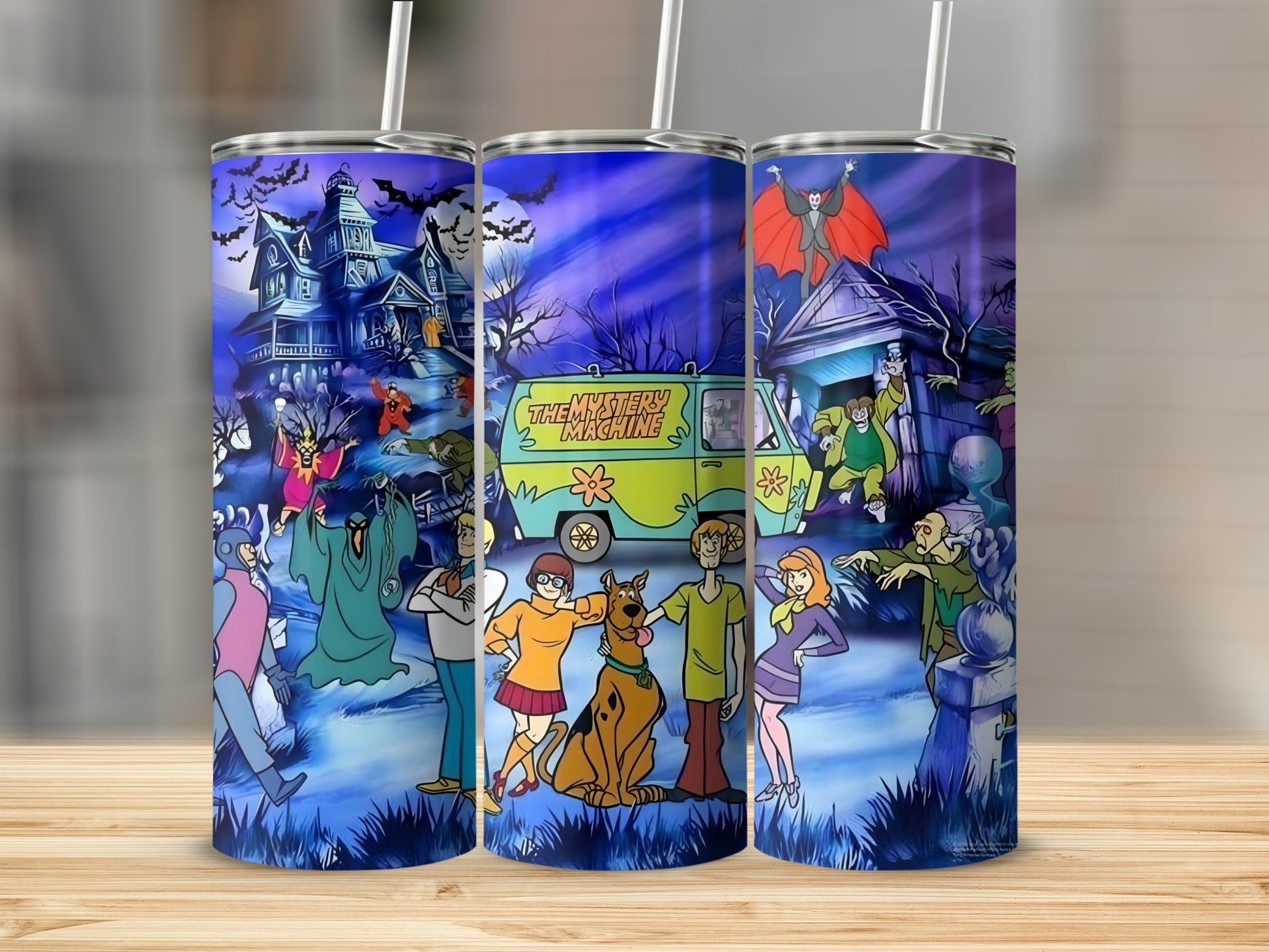 Scooby-Doo characters and Mystery Machine on Halloween-themed tumblers.