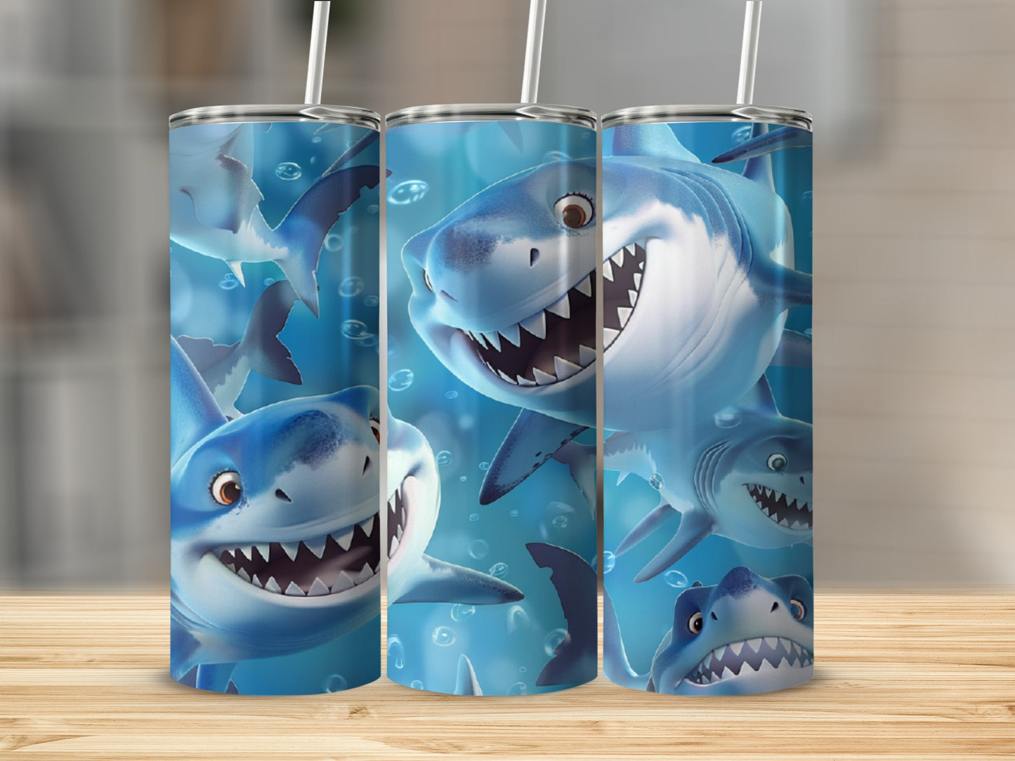 Three tumblers featuring cartoon sharks with open mouths and sharp teeth.