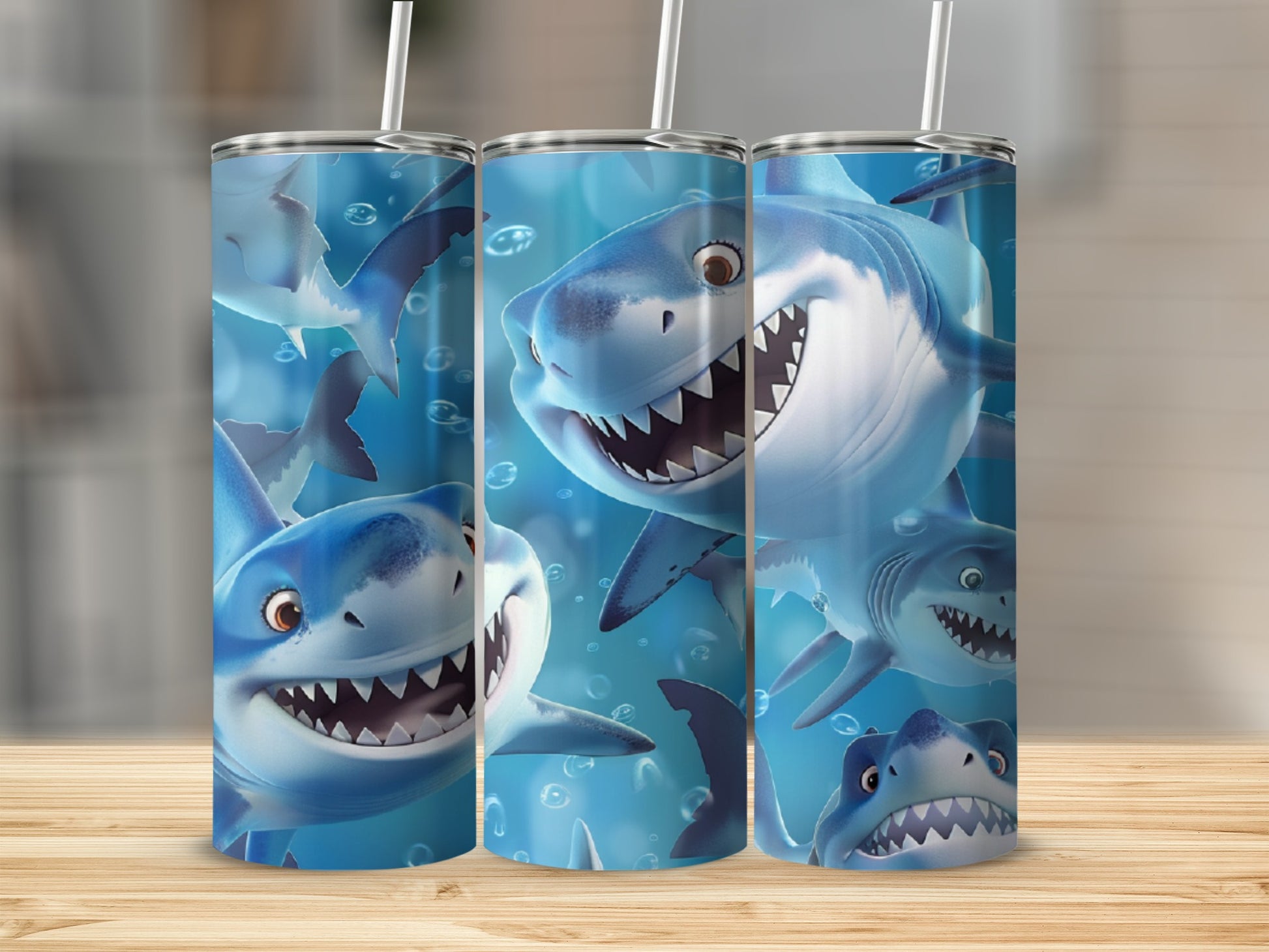 Three tumblers featuring cartoon sharks with open mouths and sharp teeth.