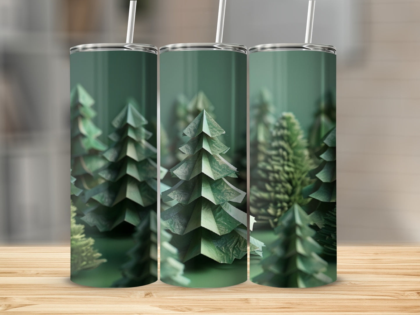 Three green tumblers with a forest of paper trees design.