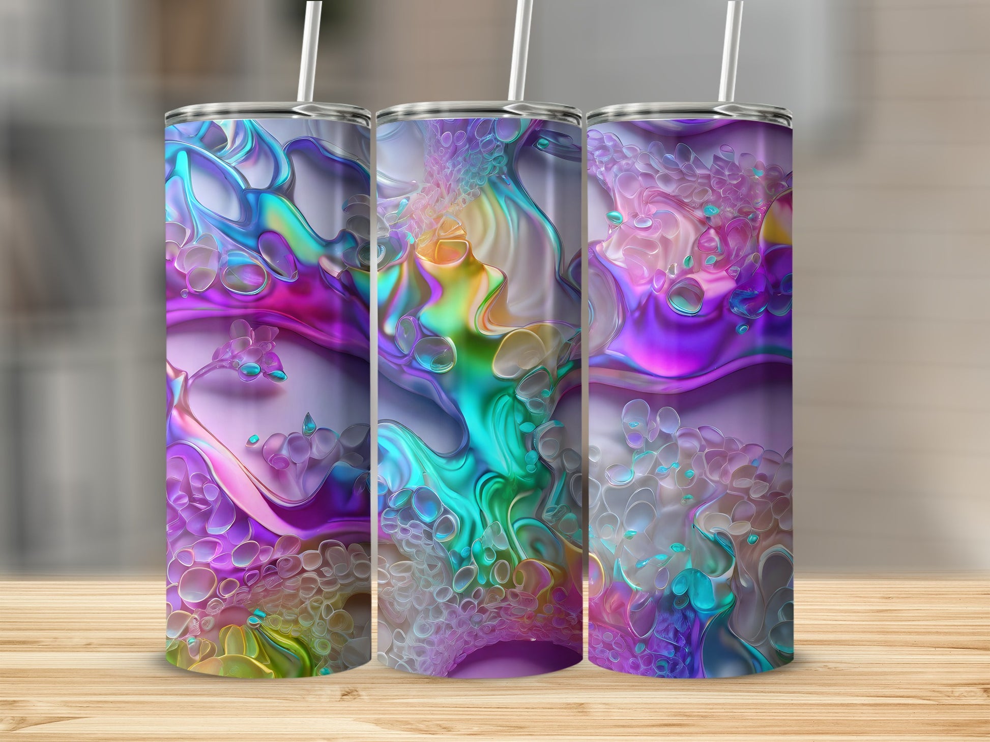 Three iridescent tumblers with colorful, organic, bubbly patterns.