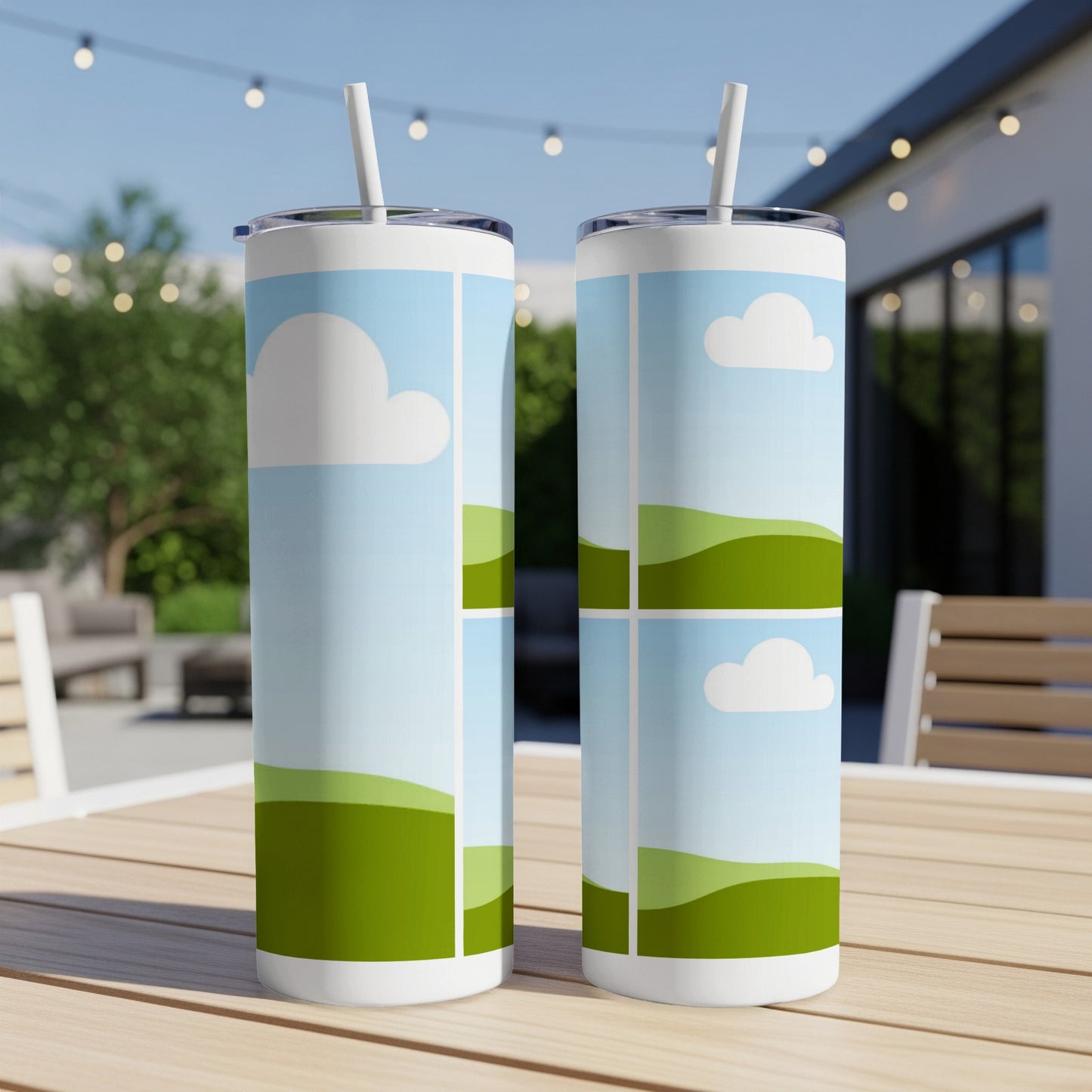 Two white tumblers with cartoon clouds and green rolling hills pattern.
