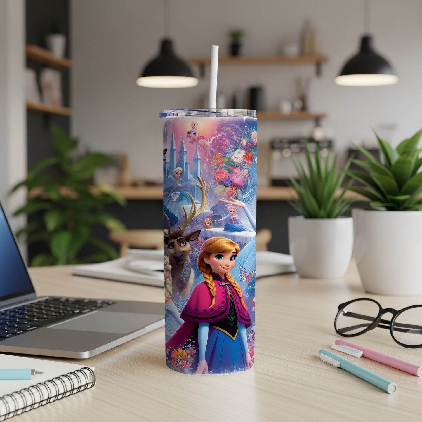 Elsa and Anna on a colorful tumbler with castle, reindeer, and floral designs.
