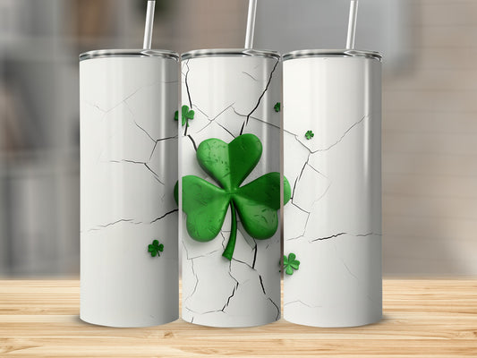 Three white tumblers with cracked texture and green shamrock designs.
