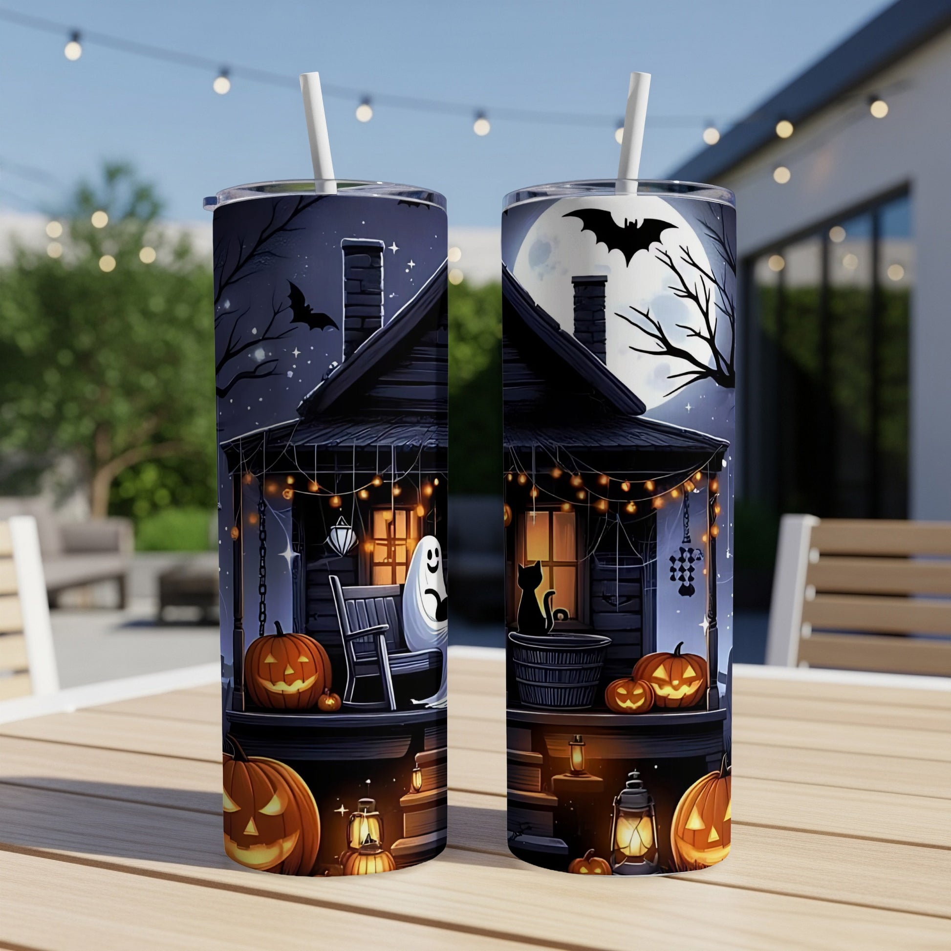 Two tumblers with Halloween house, ghost, black cat, pumpkins, and bats.