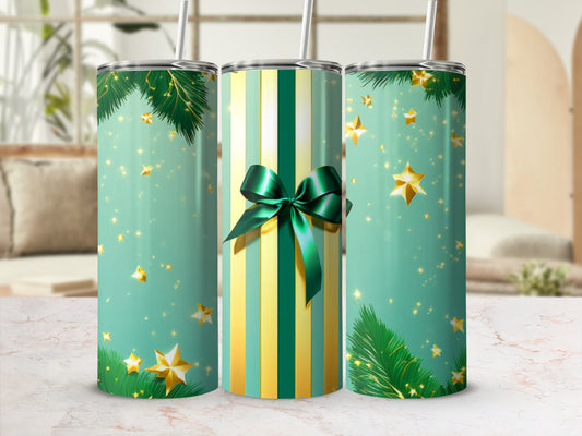 Green and gold striped tumbler with stars and pine needles.