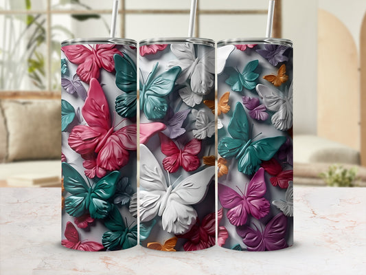Three tumblers with a colorful butterfly pattern.