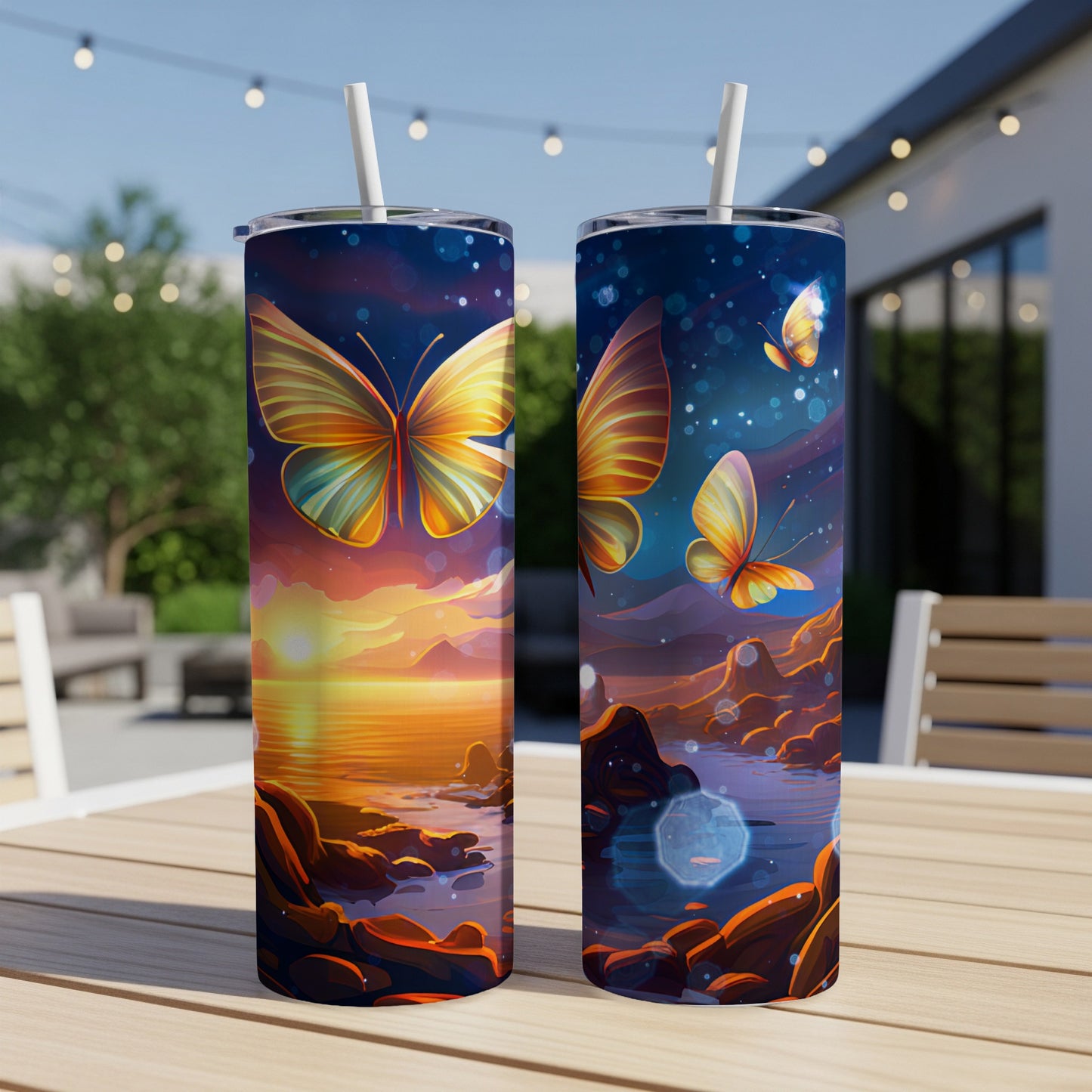Two tumblers with vibrant butterfly designs on a sunset landscape background.
